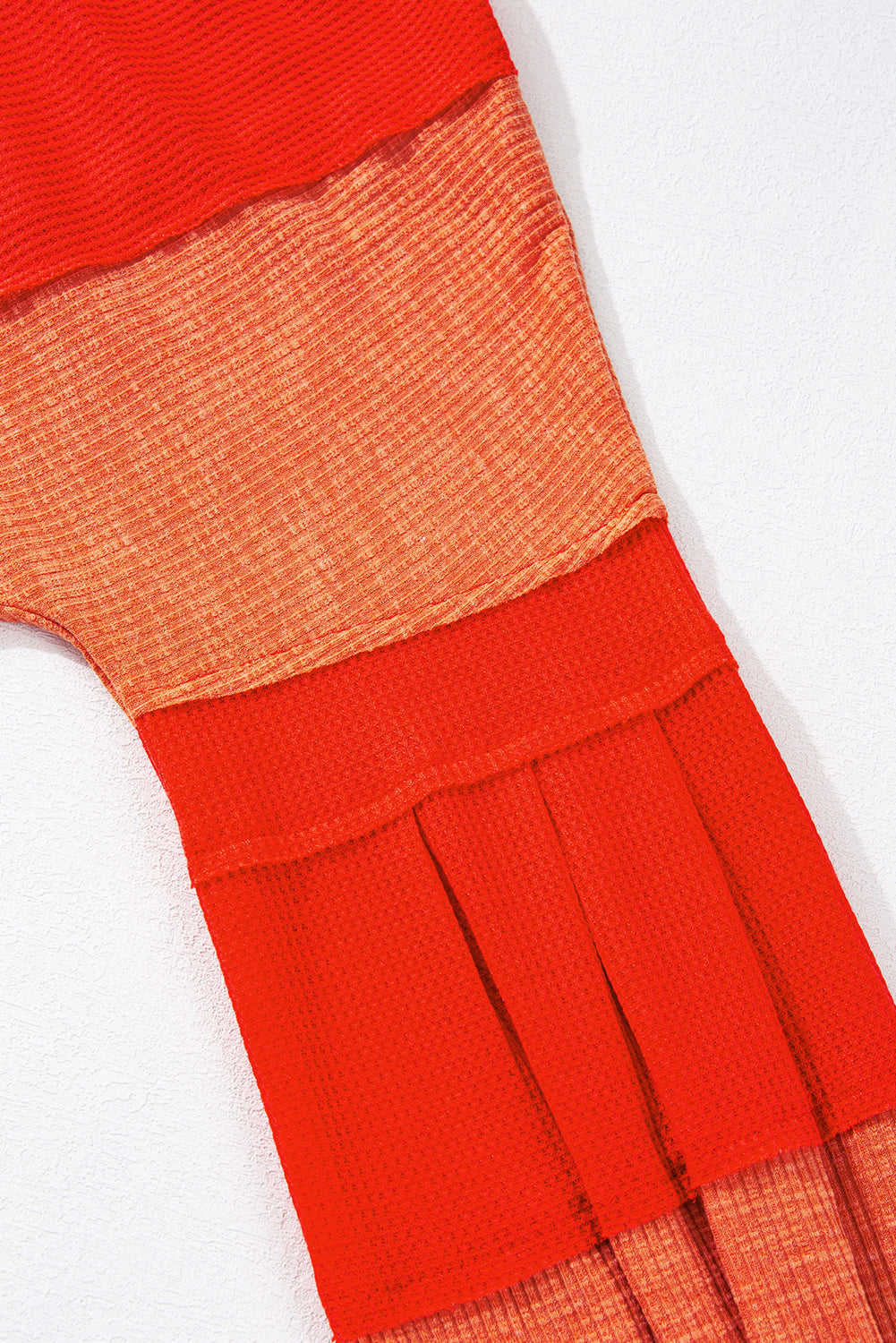 Red Studded V Neckline Exposed Seam Textured Knit Top